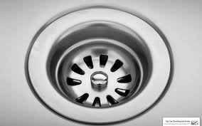 Clean metal sink drain after service