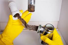 Clogged pipe section being cleaned