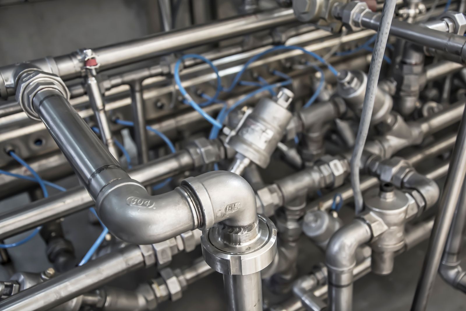 Close-up of metal pipe elbows and connections
